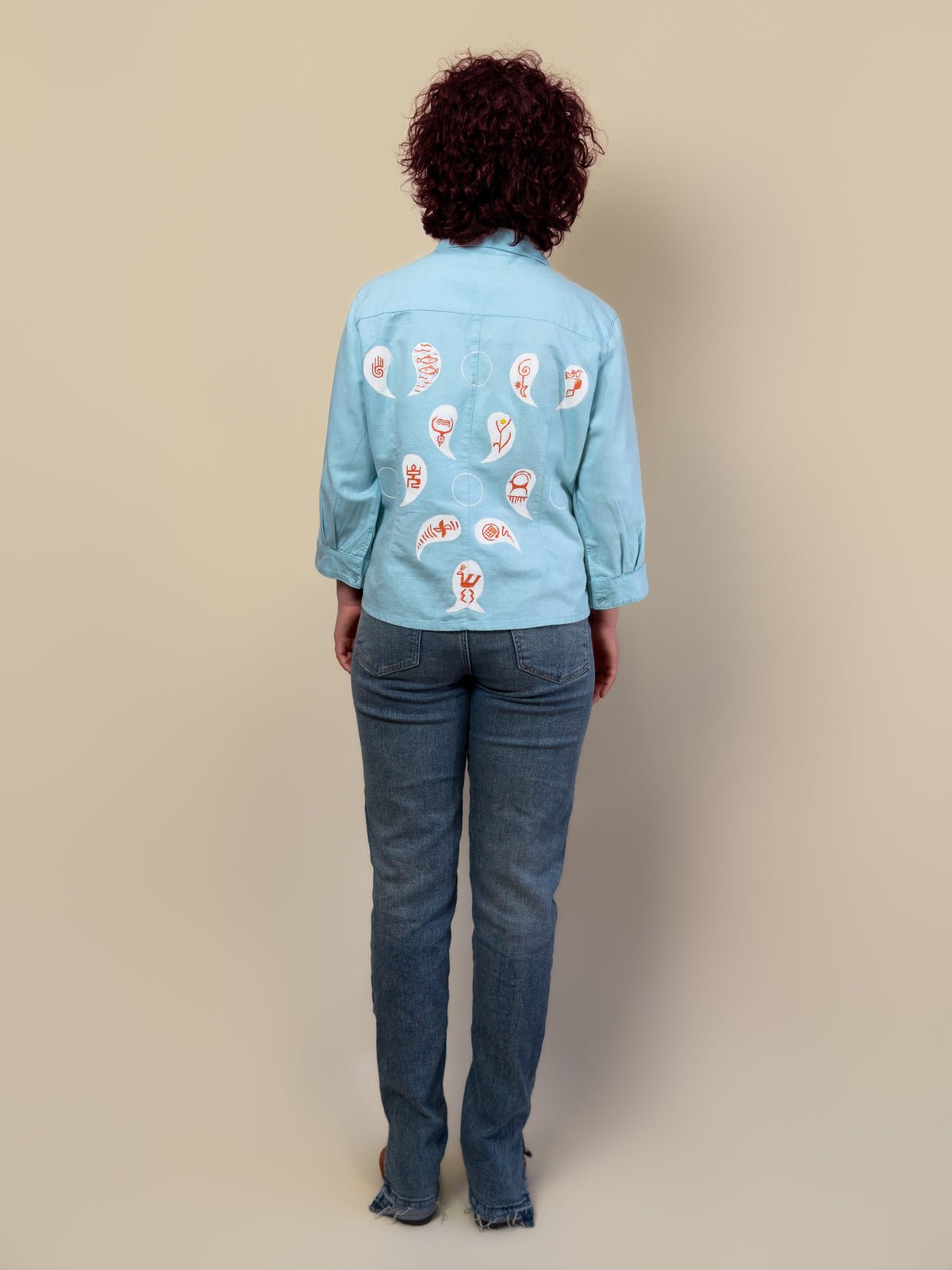 Back view of the Before Borders | Under One Sun turquoise shirt jacket by HANDLURIA.