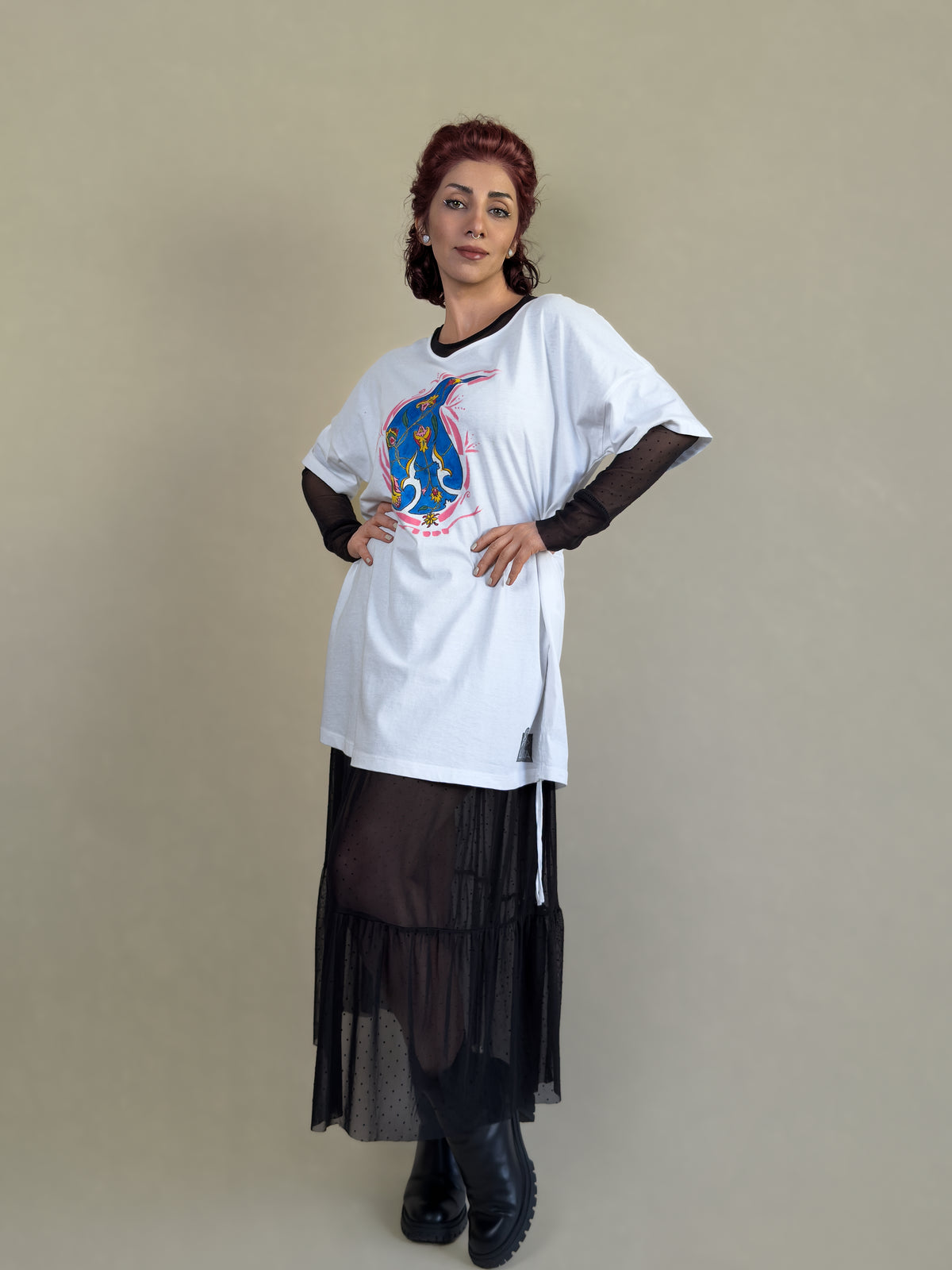 Front view of the Blue Paisley Drift white tunic by HANDLURIA, featuring a hand-painted blue paisley motif with floral details.