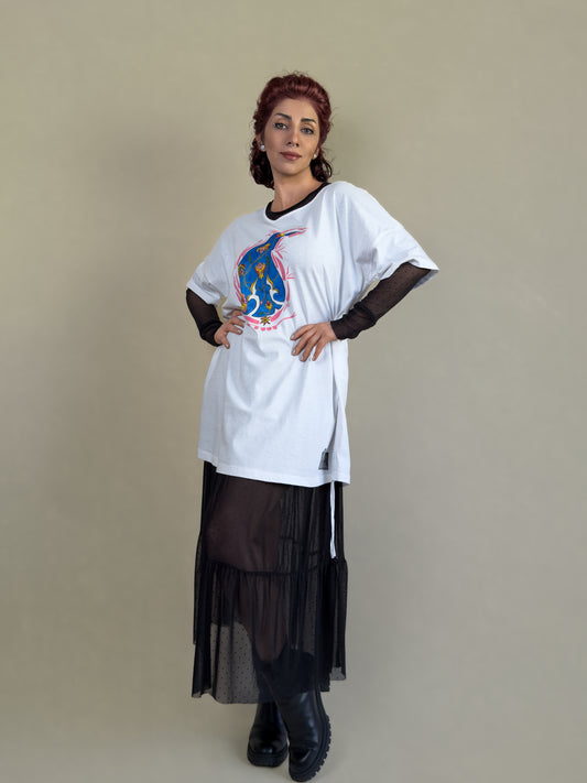 Front view of the Blue Paisley Drift white tunic by HANDLURIA, featuring a hand-painted blue paisley motif with floral details.