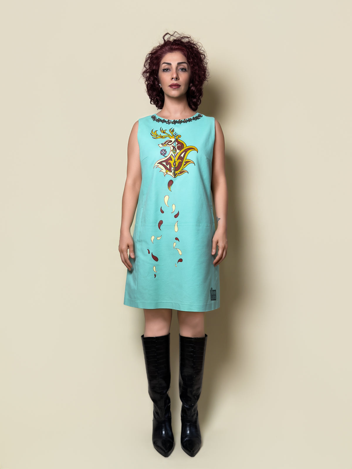 Front view of the Fireborne Stag turquoise sleeveless dress by HANDLURIA, featuring a hand-painted stag motif.