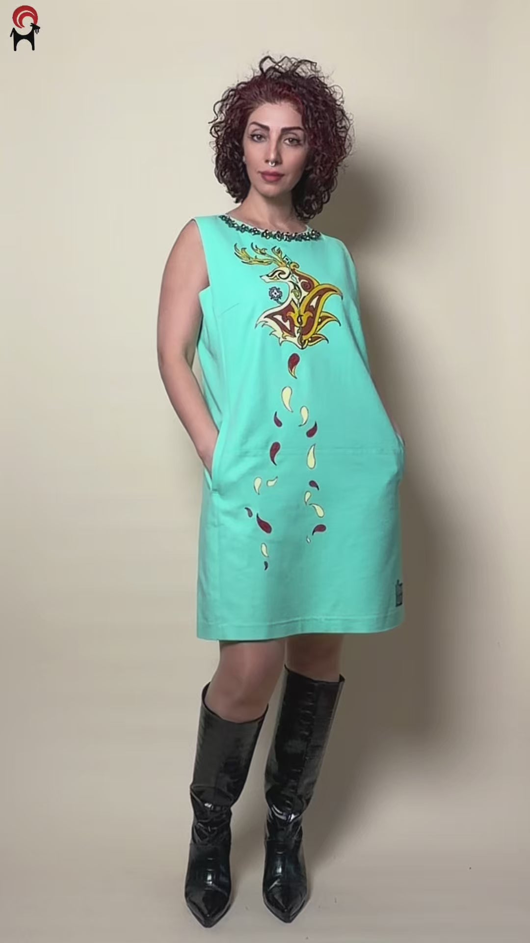 Fireborne Stag hand-painted turquoise dress by HANDLURIA worn in motion.