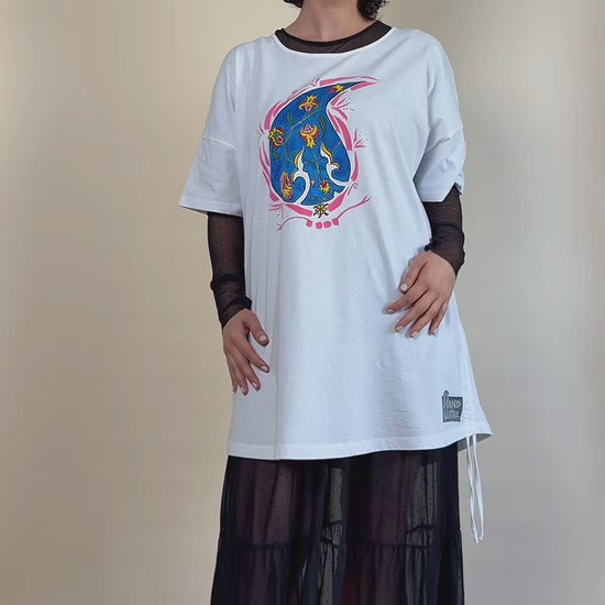 Blue Paisley Drift hand-painted white tunic by HANDLURIA worn in motion.