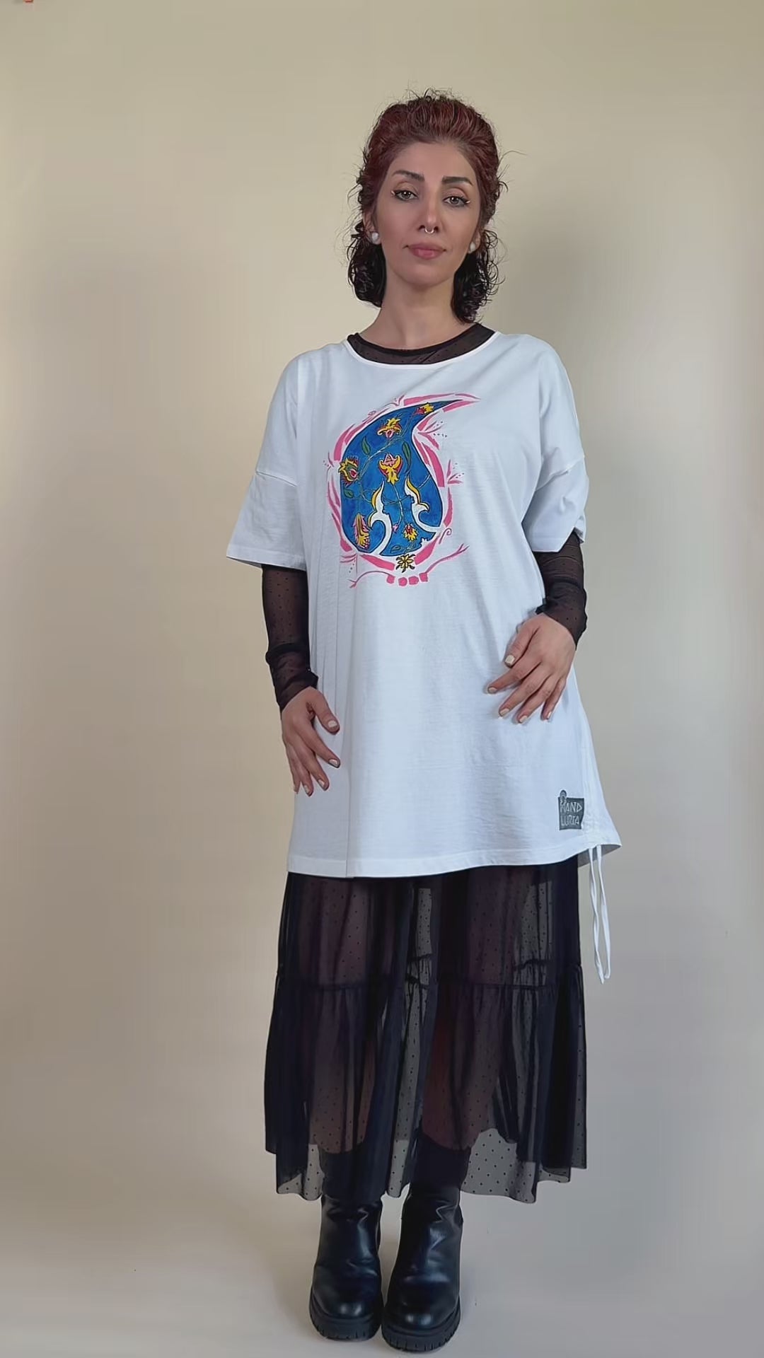 Blue Paisley Drift hand-painted white tunic by HANDLURIA worn in motion.